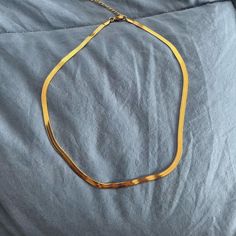 Gold tone, herringbone chain, 15 inches with extender